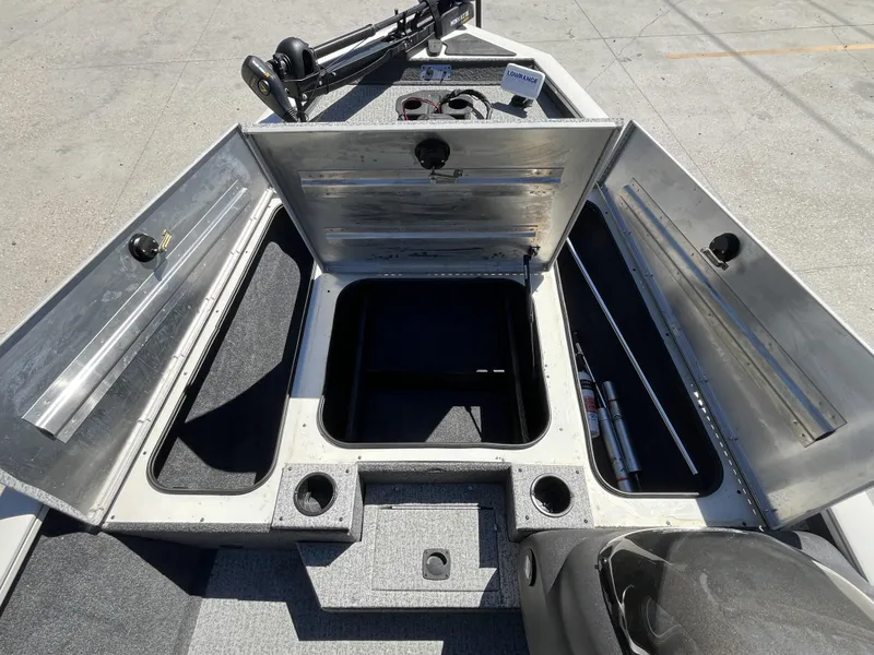 Slide: The Image of 2021 Tracker Pro Team 175 TXW Tournament Edition boat with open storage compartments. - 12