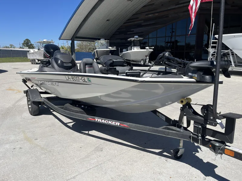 Slide: The Image of 2021 Tracker Pro Team 175 TXW Tournament Edition boat on trailer, parked outdoors. - 7