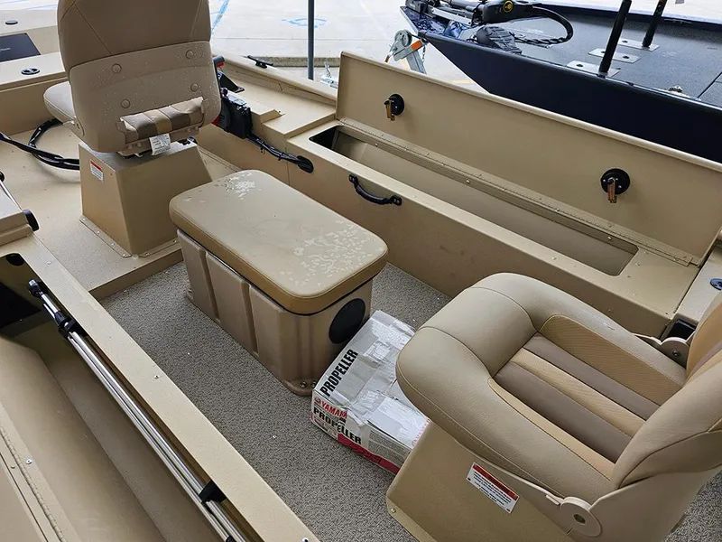 Slide: The Image of 2025 G3 Sportsman 1610 SS boat interior with beige seating and storage compartments. - 11
