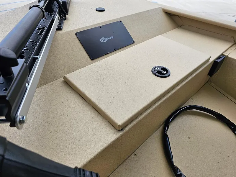 Slide: The Image of 2025 G3 Sportsman 1610 SS boat interior with beige deck and mounted equipment. - 13