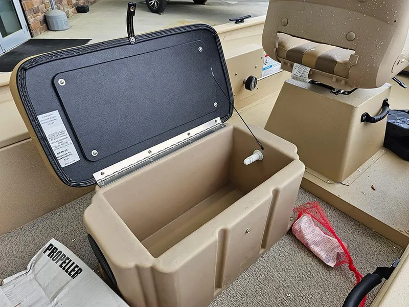 Slide: The Image of Open storage compartment in 2025 G3 Sportsman 1610 SS boat interior. - 19