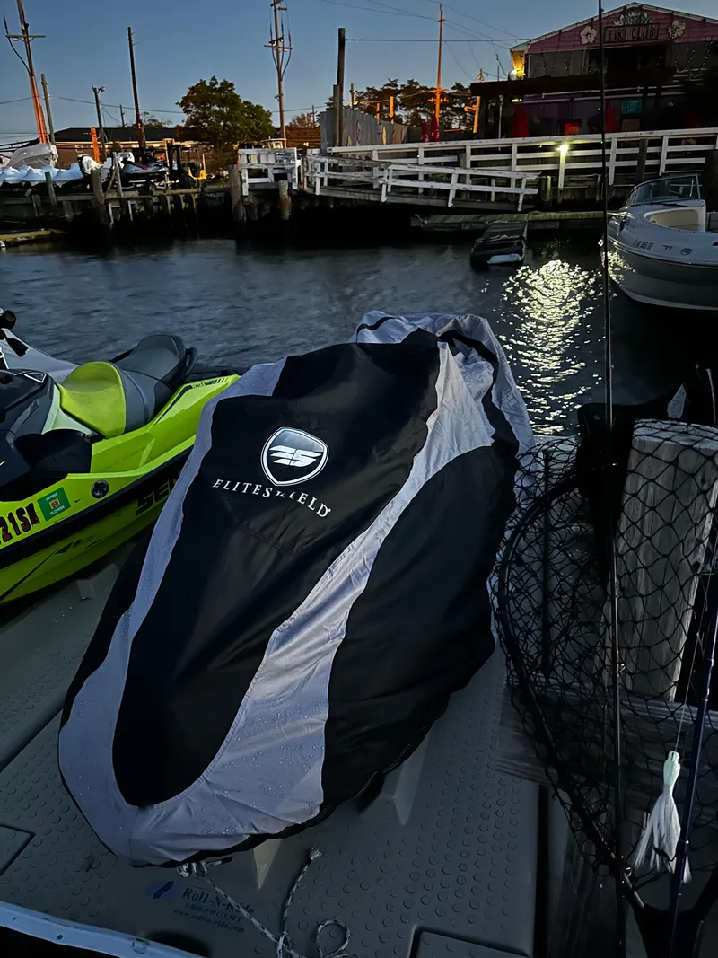 Slide: The Image of 2019 Sea-Doo GTR 230 covered, docked by waterfront at dusk. - 10