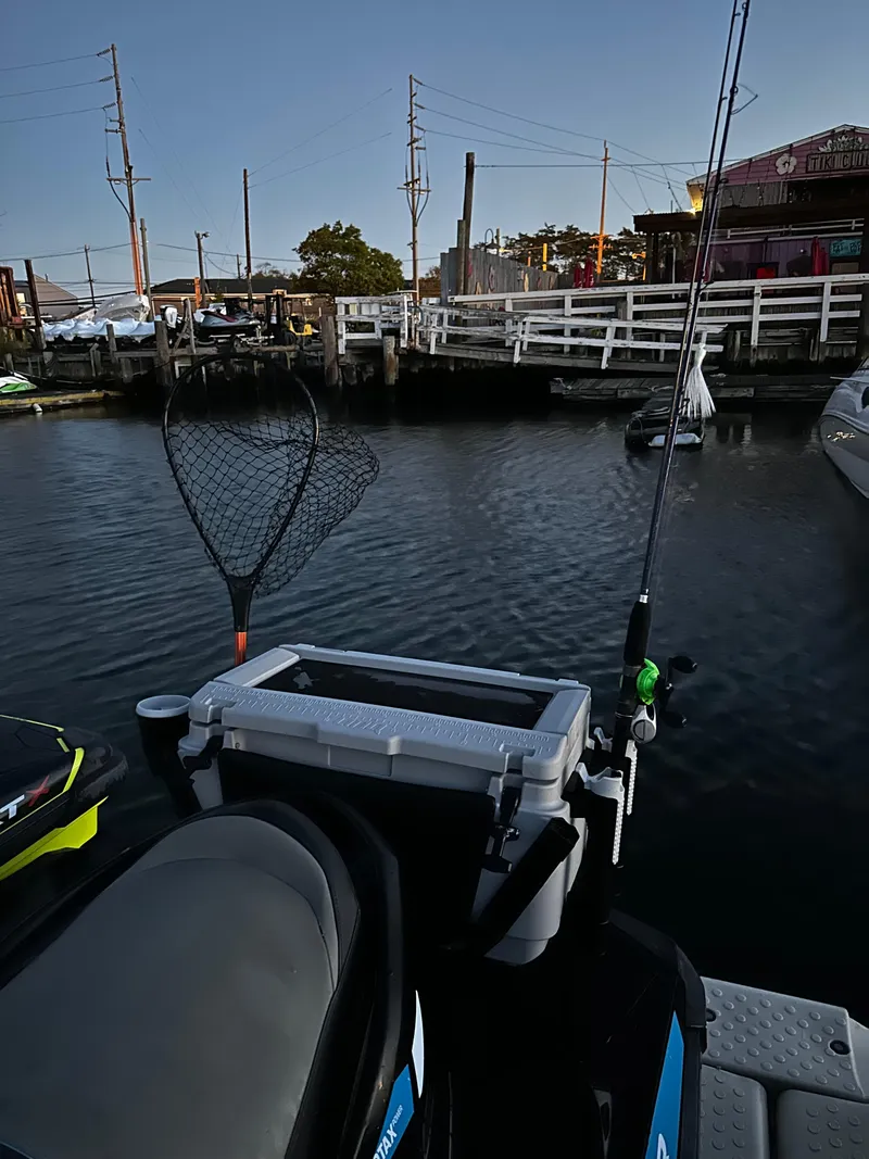 Slide: The Image of 2019 Sea-Doo GTR 230 with fishing gear docked at a marina. - 11