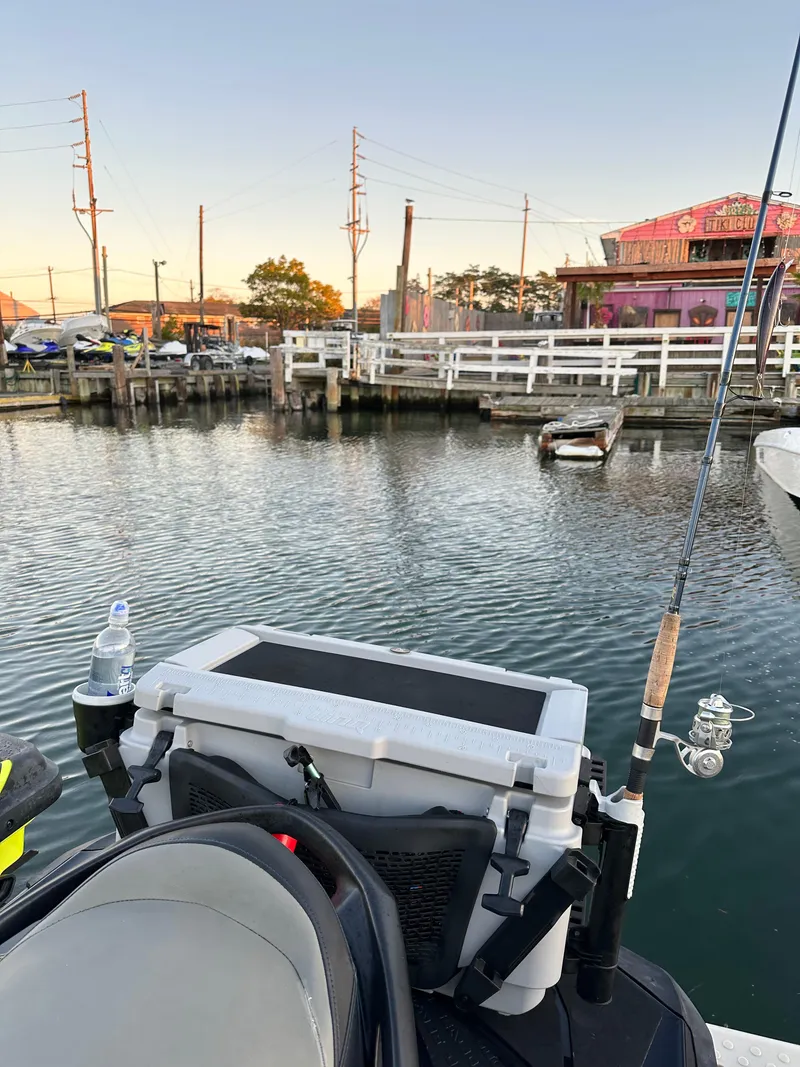 Slide: The Image of 2019 Sea-Doo GTR 230 docked by a scenic waterfront with fishing gear. - 14