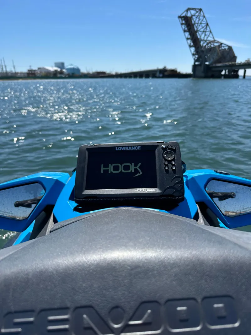Slide: The Image of 2019 Sea-Doo GTR 230 with Lowrance Hook GPS on water near a drawbridge. - 8