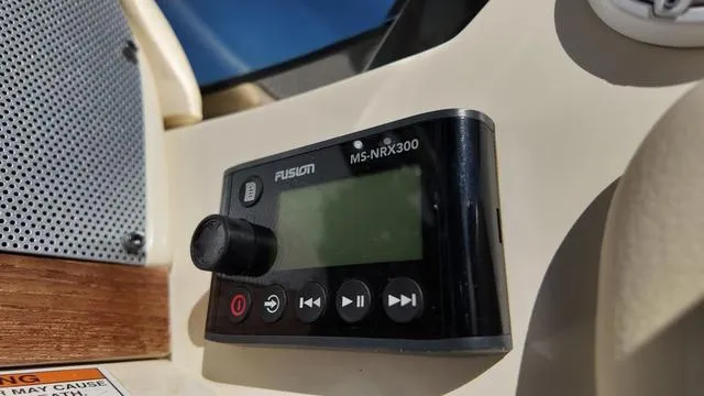 Slide: The Image of Fusion MS-NRX300 stereo system on 2017 Chris-Craft Launch 27 boat dashboard. - 20