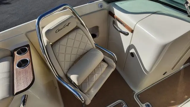 Slide: The Image of Luxurious seating in 2017 Chris-Craft Launch 27 boat with elegant design and cup holders. - 21