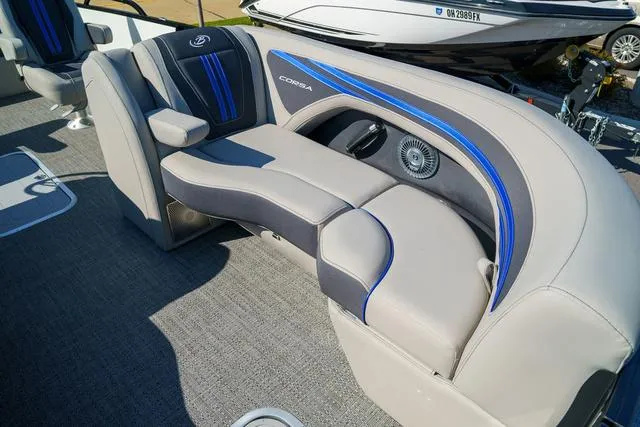 Slide: The Image of 2025 Barletta Corsa 23UC boat interior with gray and blue seating. - 11