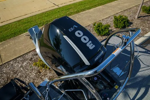 Slide: The Image of 2025 Barletta Corsa 23UC boat with powerful outboard motor, parked on a sunny day. - 22