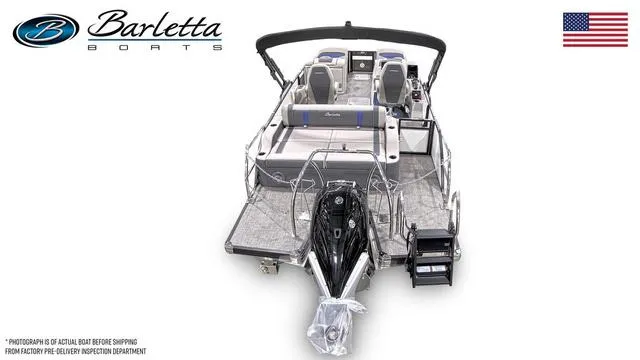 Slide: The Image of 2025 Barletta Corsa 23UC pontoon boat, rear view, showcasing seating and motor, with American flag. - 6