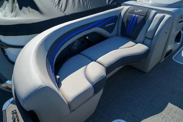 Slide: The Image of 2025 Barletta Corsa 23UC boat seating with sleek, modern design and blue accents. - 8