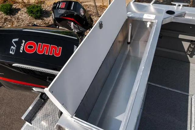 Slide: The Image of 2024 Thunder Jet Alexis Pro 22' boat with open storage compartment and powerful outboard motors. - 19