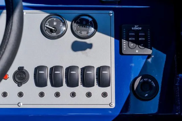 Slide: The Image of Control panel of 2024 Thunder Jet Alexis Pro 22' boat, featuring gauges and switches. - 4
