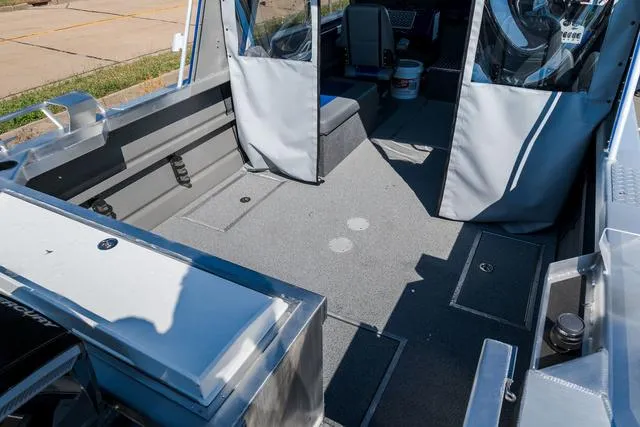 Slide: The Image of 2024 Thunder Jet Alexis Pro 22' boat interior with spacious deck and seating. - 5