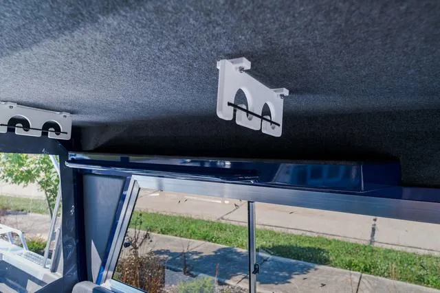 Slide: The Image of 2024 Thunder Jet Alexis Pro 22' interior ceiling with rod holders. - 8