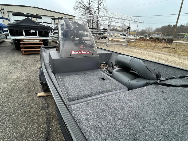 Slide: The Image of 2020 Tracker Bass Tracker Classic XL boat with gray interior, parked outdoors. - 13