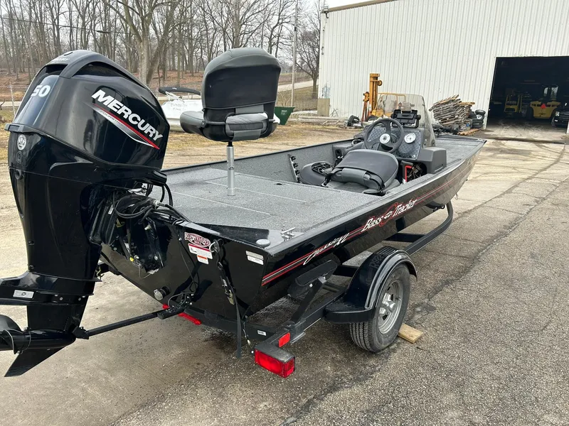 Slide: The Image of 2020 Tracker Bass Tracker Classic XL boat with Mercury engine, parked outdoors. - 3