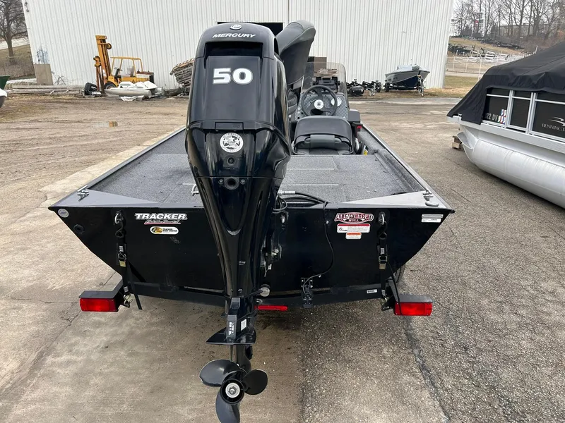 Slide: The Image of 2020 Tracker Bass Tracker Classic XL boat with Mercury 50 engine, parked outdoors. - 6