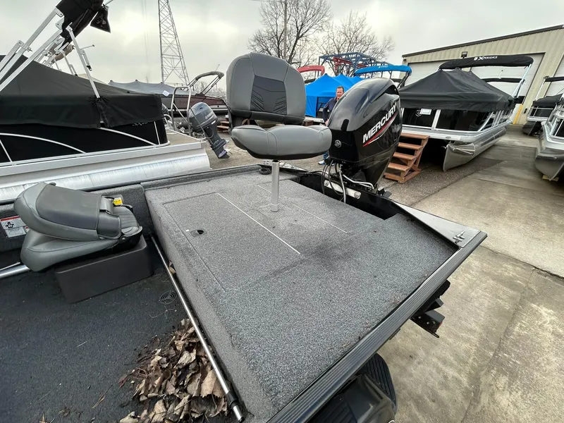 Slide: The Image of 2020 Tracker Bass Tracker Classic XL boat with Mercury motor in a marina setting. - 7