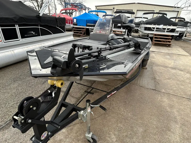 Slide: The Image of 2020 Tracker Bass Tracker Classic XL boat on trailer in a marina setting. - 8