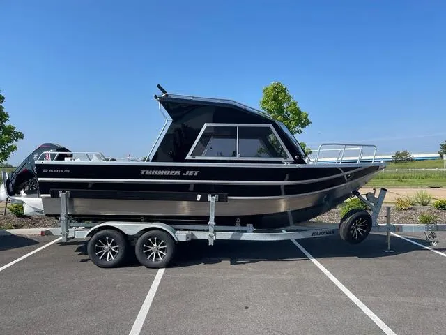 The Image of 2024 Thunder Jet Alexis OS 22' boat on trailer in parking lot. - 1