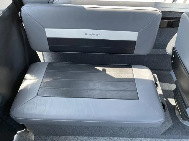 Slide: The Image of 2024 Thunder Jet Alexis OS 22' boat interior seating, featuring sleek gray upholstery. - 26
