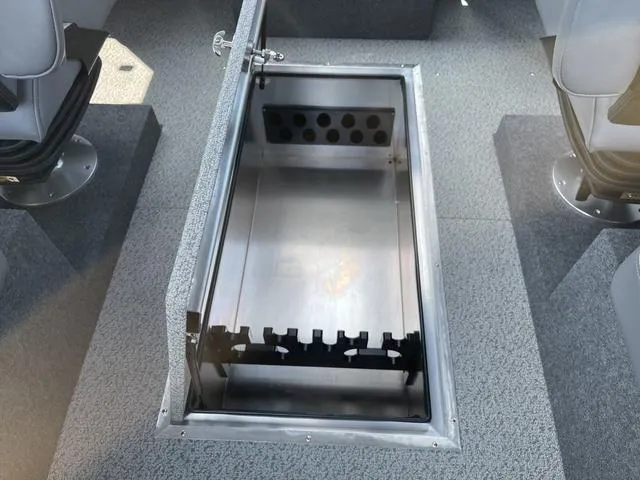 Slide: The Image of 2024 Thunder Jet Alexis OS 22' boat interior storage compartment with open lid. - 28