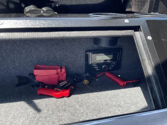 Slide: The Image of Storage compartment in 2024 Thunder Jet Alexis OS 22' boat with electronic equipment. - 30