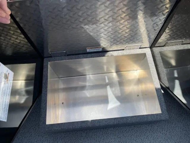 Slide: The Image of Storage compartment of 2024 Thunder Jet Alexis OS 22' boat, open and empty. - 35