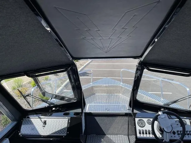 Slide: The Image of 2024 Thunder Jet Alexis OS 22' boat interior with modern dashboard and sleek design. - 36