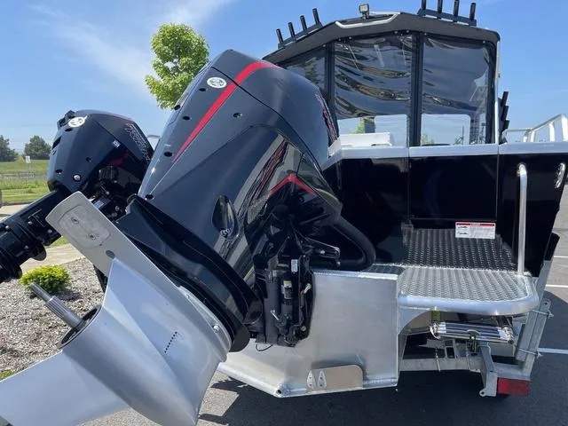 Slide: The Image of 2024 Thunder Jet Alexis OS 22' boat with dual outboard motors, rear view. - 5