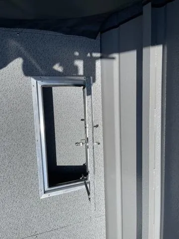 Slide: The Image of 2024 Thunder Jet Alexis OS 22' interior detail, featuring a window frame and textured wall. - 19