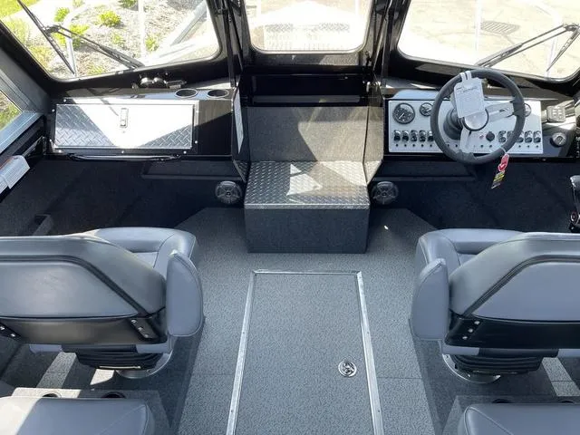 Slide: The Image of 2024 Thunder Jet Alexis OS 22' boat interior with modern dashboard and seating. - 24