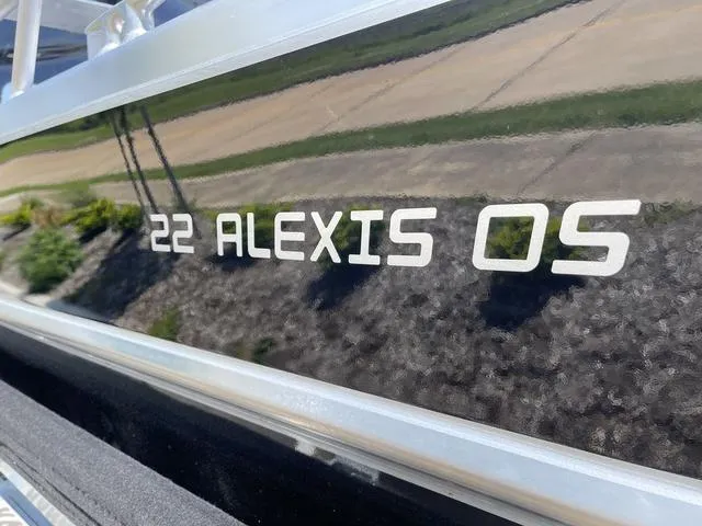Slide: The Image of 2024 Thunder Jet Alexis OS 22' boat exterior with model name displayed. - 7
