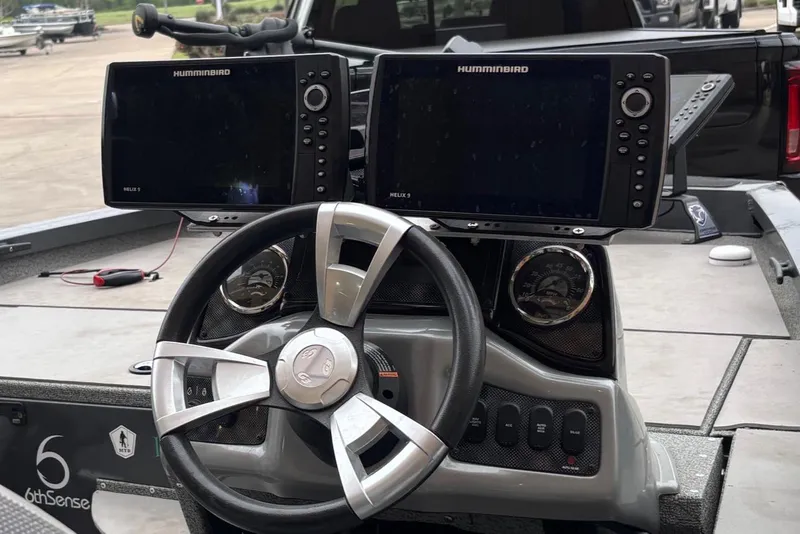 Slide: The Image of 2020 G3 Sportsman 1610 boat dashboard with dual Humminbird fish finders. - 6