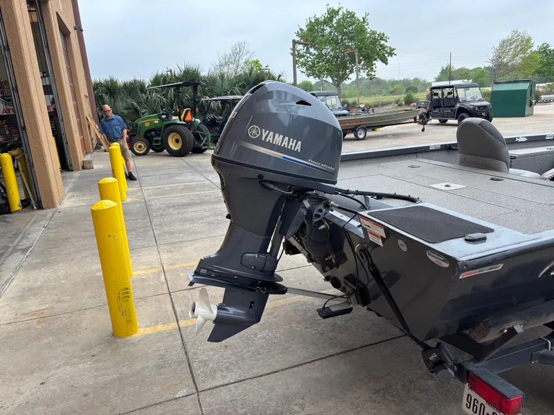 Slide: The Image of 2020 G3 Sportsman 1610 boat with Yamaha outboard motor in a parking area. - 8