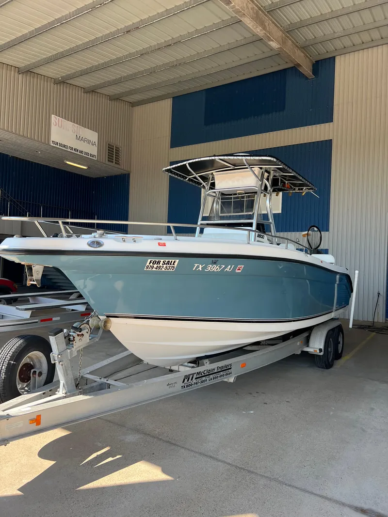 Slide: The Image of 2007 Century 2600 CC boat on trailer in covered storage area. - 1