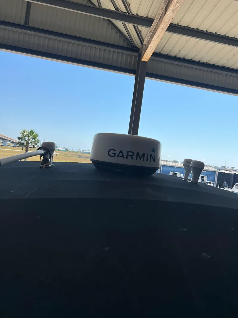 Slide: The Image of Garmin radar on 2007 Century 2600 CC boat under a metal roof. - 12