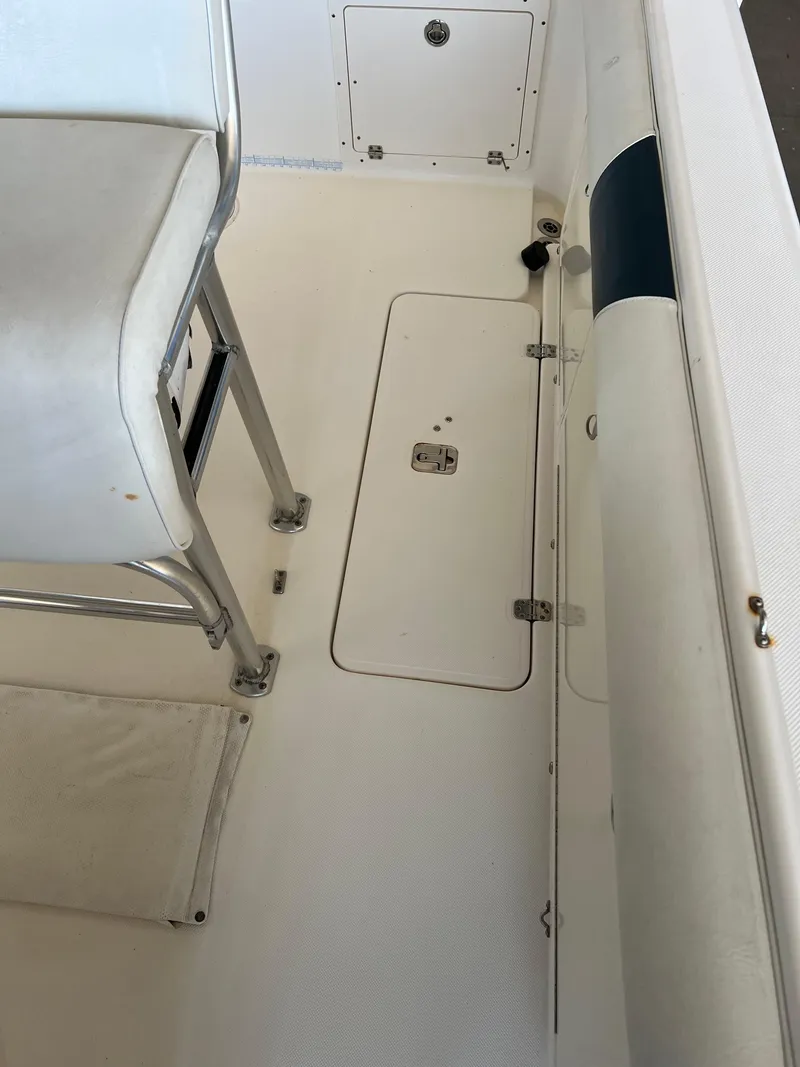 Slide: The Image of 2007 Century 2600 CC boat interior with seating and storage compartments. - 14