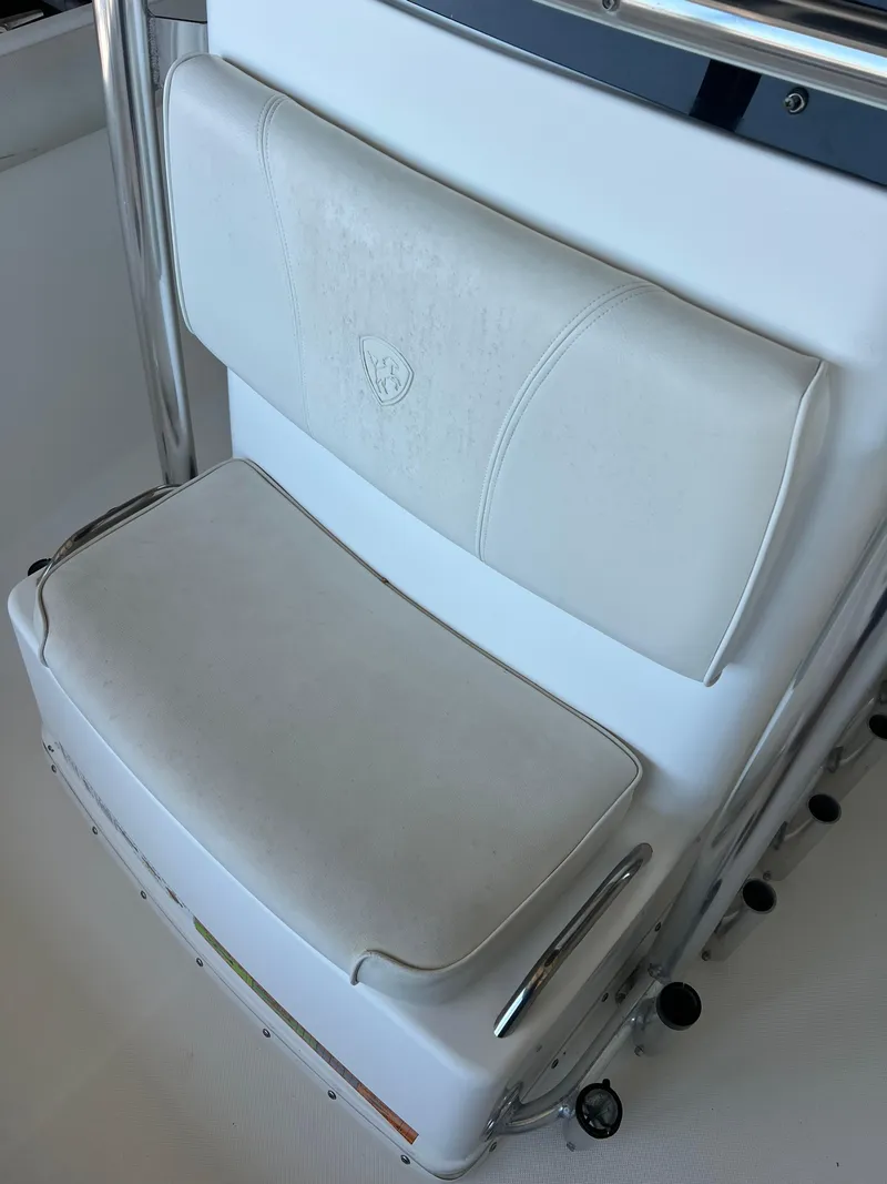 Slide: The Image of White seat on a 2007 Century 2600 CC boat, featuring stainless steel accents. - 17