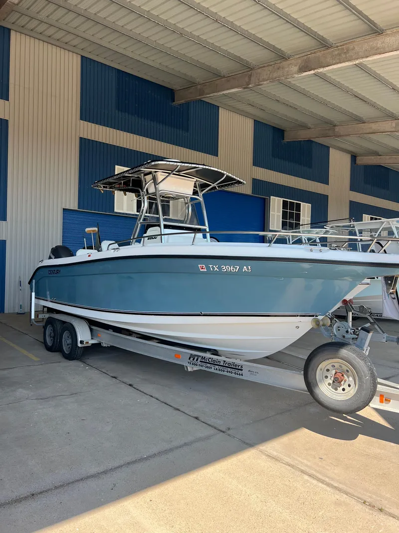 Slide: The Image of 2007 Century 2600 CC boat on trailer in covered storage area. - 2