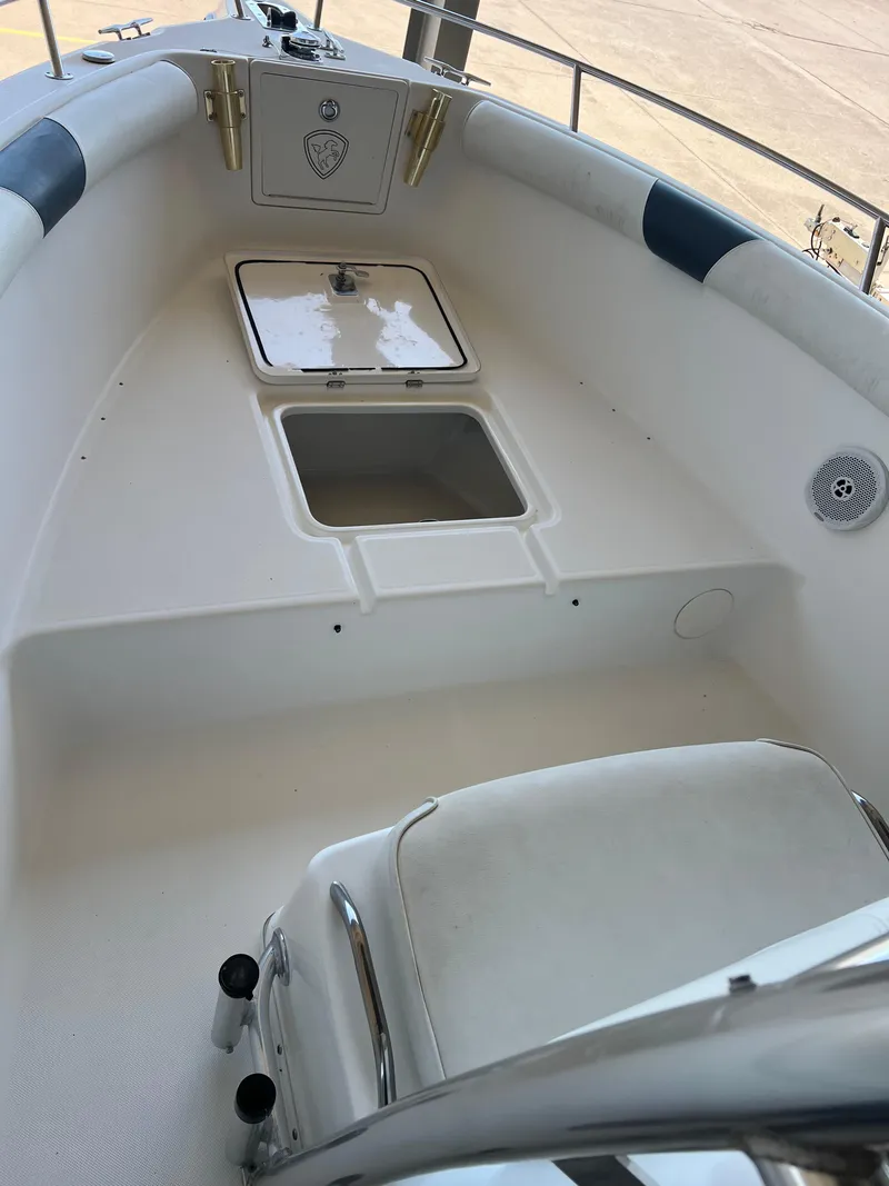 Slide: The Image of 2007 Century 2600 CC boat interior with storage compartments and seating. - 20
