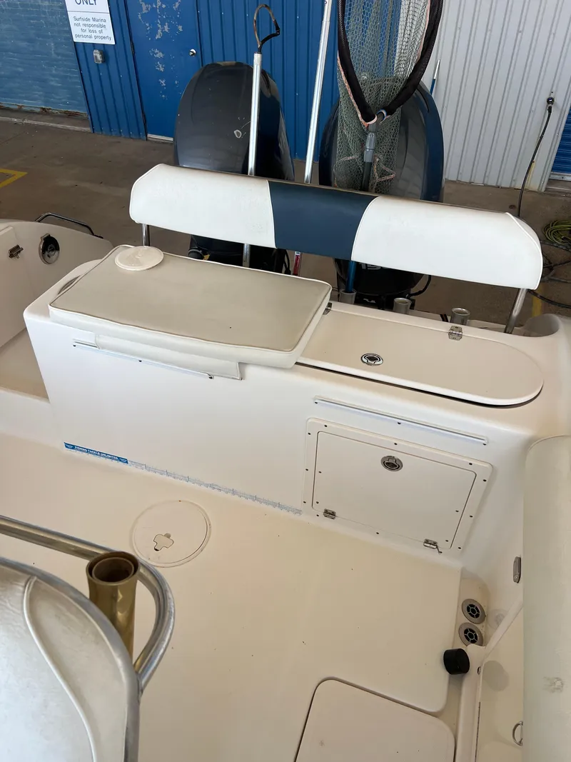 Slide: The Image of 2007 Century 2600 CC boat interior with seating and storage compartments. - 23