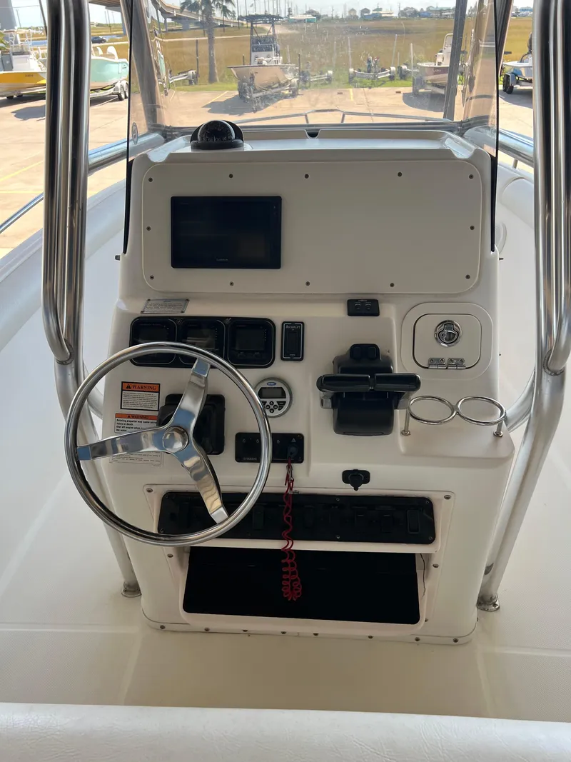 Slide: The Image of 2007 Century 2600 CC boat console with steering wheel and control panel. - 25