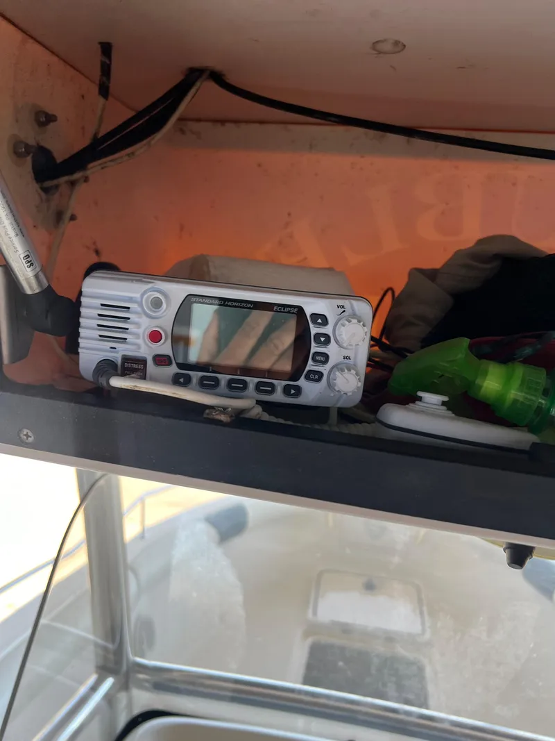 Slide: The Image of Boat interior with a radio device on a shelf, Century 2600 CC, 2007 model. - 3