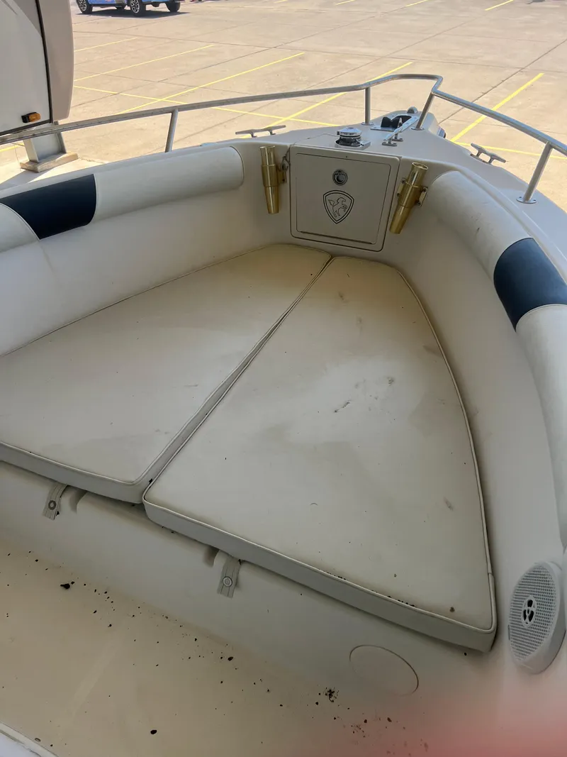 Slide: The Image of 2007 Century 2600 CC boat interior with cushioned seating and storage compartment. - 30