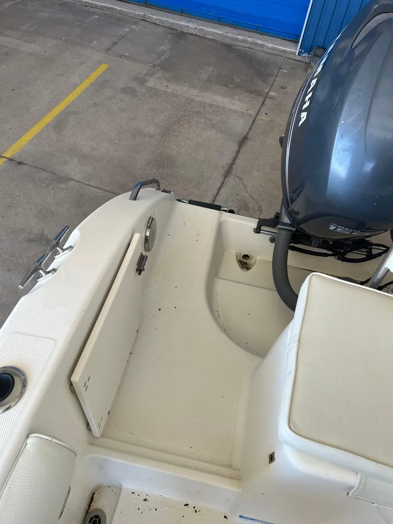 Slide: The Image of 2007 Century 2600 CC boat interior with Yamaha outboard motor in a garage. - 31