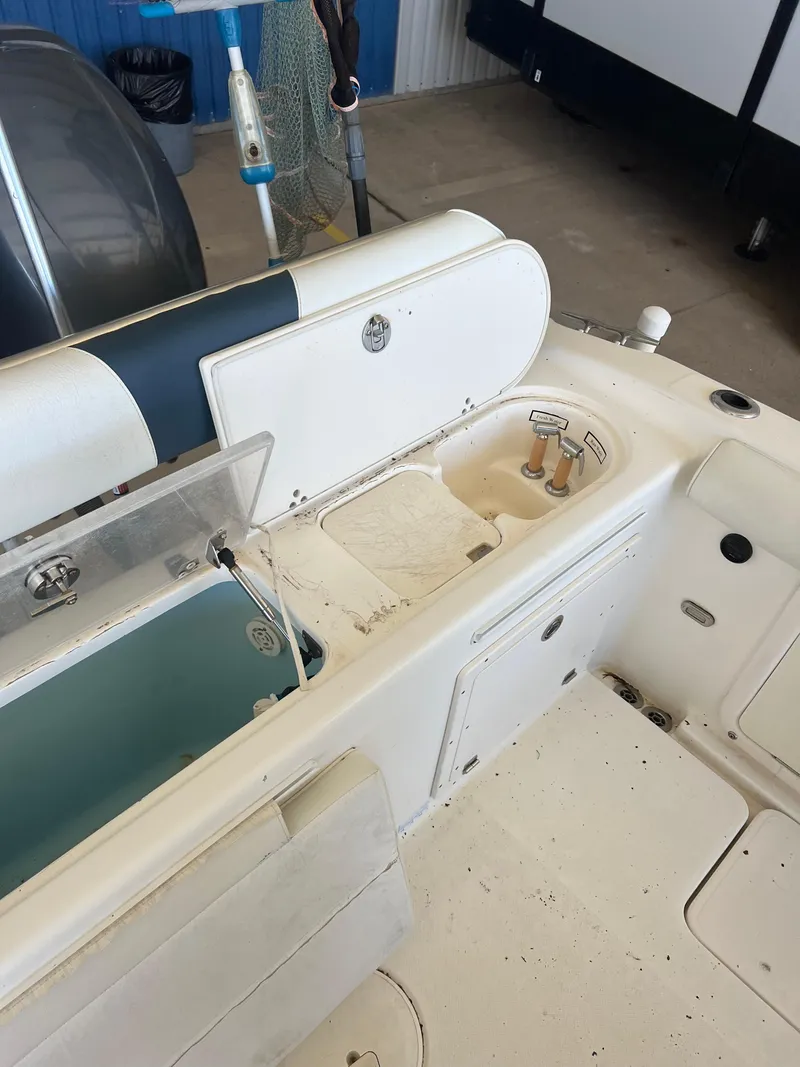 Slide: The Image of 2007 Century 2600 CC boat interior with seating and storage compartments. - 32