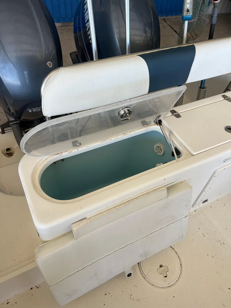 Slide: The Image of 2007 Century 2600 CC boat with open storage compartment and dual engines. - 33