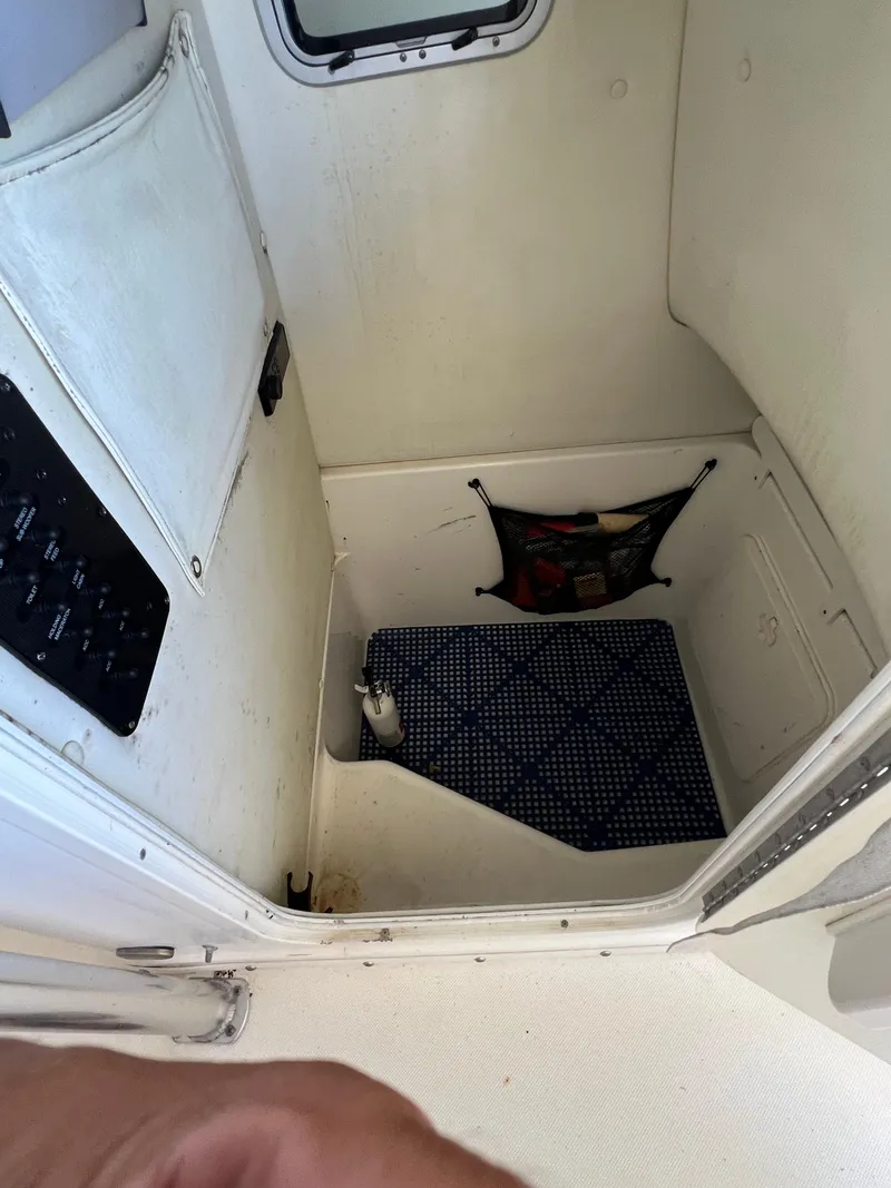 Slide: The Image of Interior of a 2007 Century 2600 CC boat cabin with storage and mat. - 34